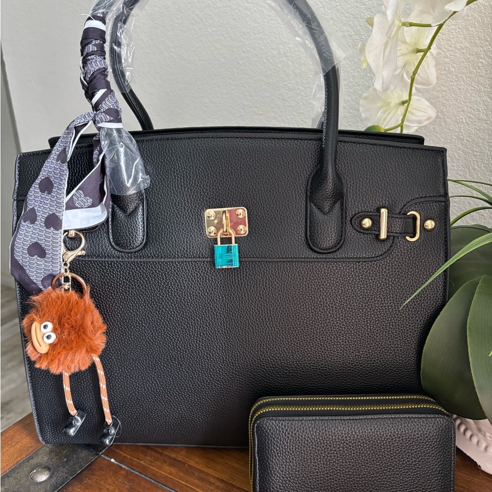 Elegant Black Handbag with Gold Accents